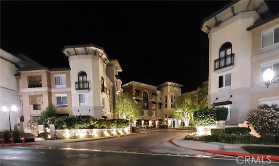 Night view of a multi-story residential building complex.
