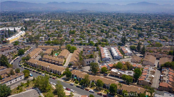 Wide-angle aerial view of a residential area with numerous houses and buildings.