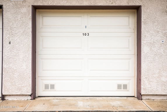 Front view of a garage door on a building exterior.