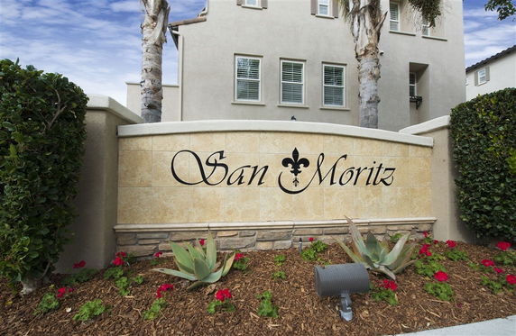 Front view of a residential building with a sign that reads 'San Moritz'.