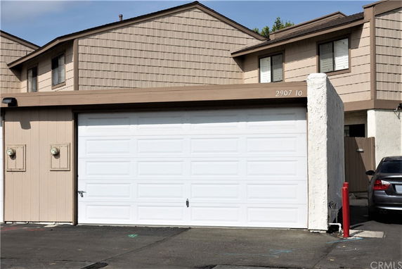 Front view of a two-story house with a double garage.