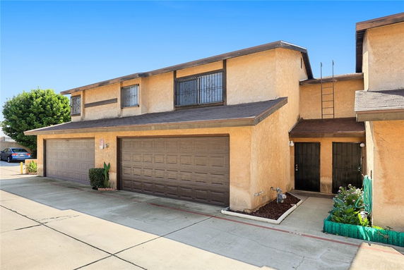 Front view of a two-story house with a double garage.