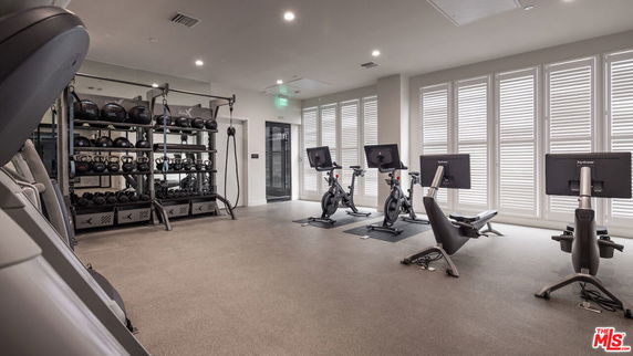 Interior view of a gym area with exercise equipment.