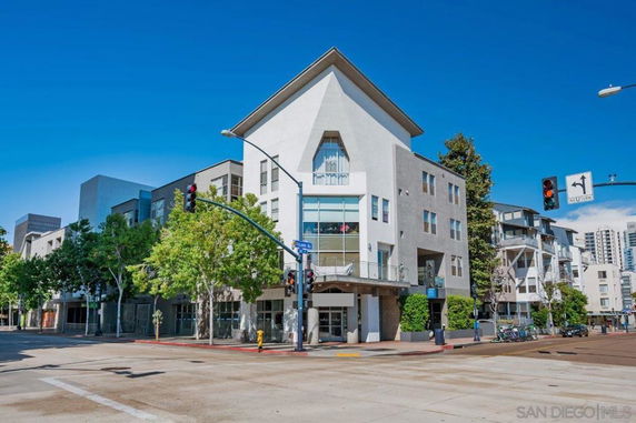 Front view of a multi-story residential building with a modern design.