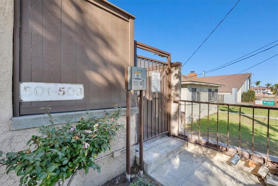 Entrance gate of a residential property with a keypad and house numbers 501-509.