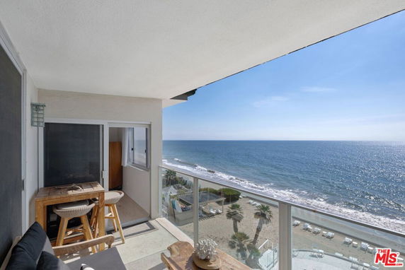 Balcony with ocean view from a high-rise building.