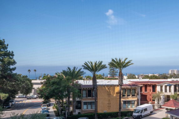 View of surrounding residential area with ocean in the background.