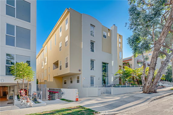 Front view of a multi-story apartment building with modern design.