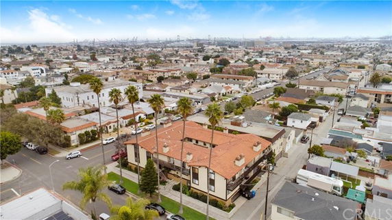 Panoramic view of a residential neighborhood with multiple houses and buildings.