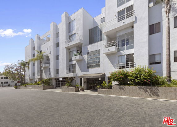 Front view of a modern multi-story apartment building.
