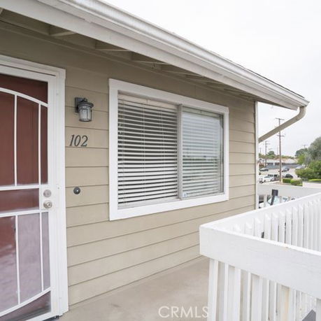 Front view of a building with a partial porch area.