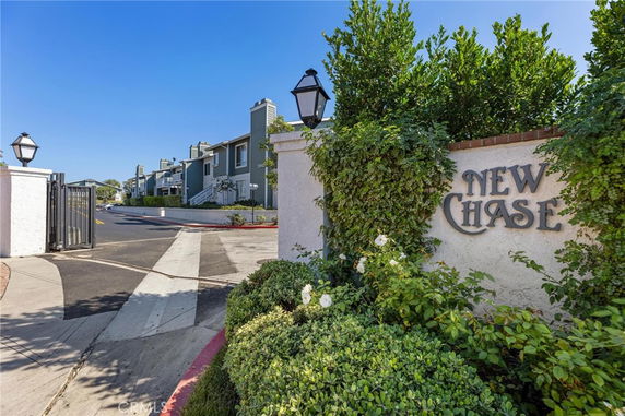 Front view of a residential building with a gated entrance.