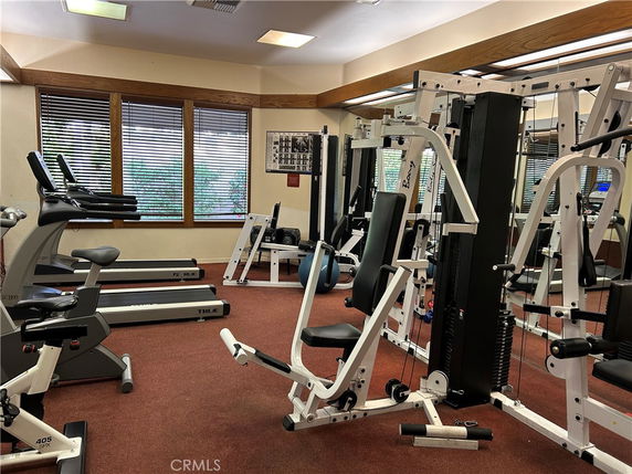 Interior view of a gym area with exercise equipment.