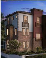 Front view of a multi-story house with a brick facade and balconies.
