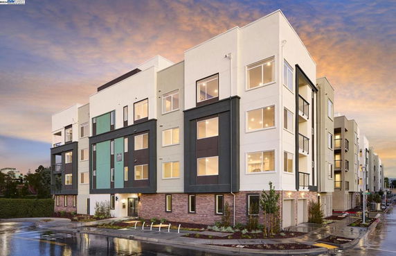 Front view of a modern multi-story apartment building.