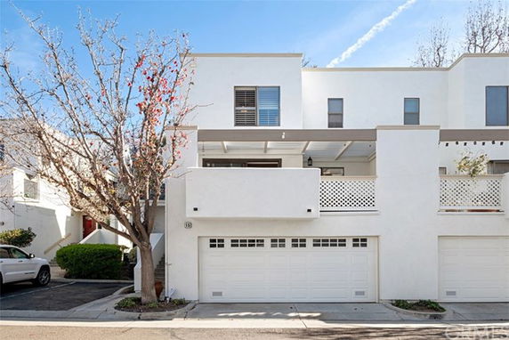 Front view of a modern two-story house with a double garage.