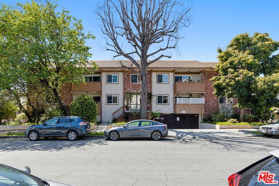 Front view of a two-story residential building with a garage.