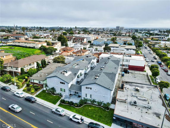 Aerial view of a residential neighborhood with multiple buildings and streets.