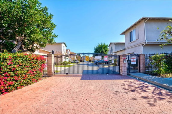 Front view of gated residential buildings with multiple units