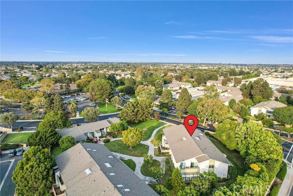 Panoramic view of a residential area with multiple houses and greenery.
