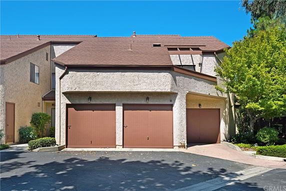 Front view of a house with a three-car garage.