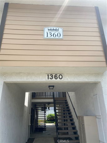 Front view of a building with stairway access.