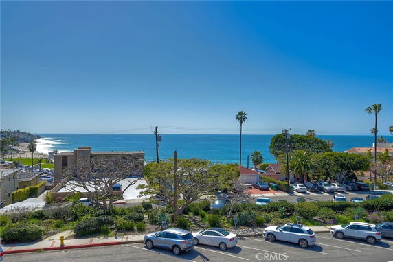 Panoramic view of the ocean and nearby buildings from an elevated position.