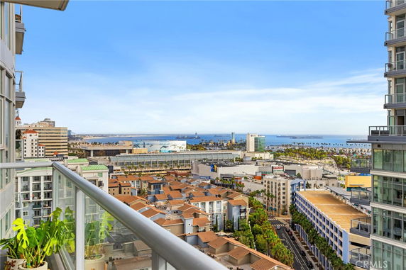 Panoramic view of cityscape with ocean in the background from a high-rise building.