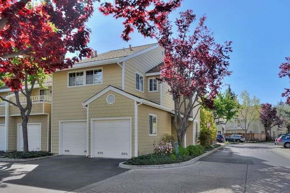 Front view of a two-story house with two garages.