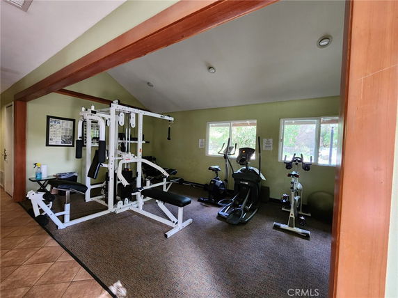 Indoor gym area with fitness equipment and exercise machines.