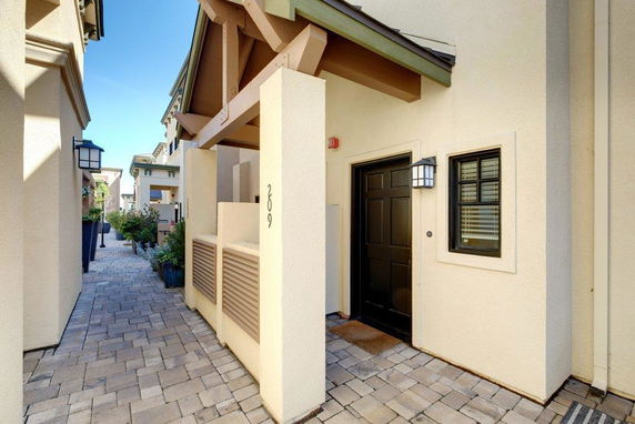 Front view of a compact entrance to a house with a small walkway.