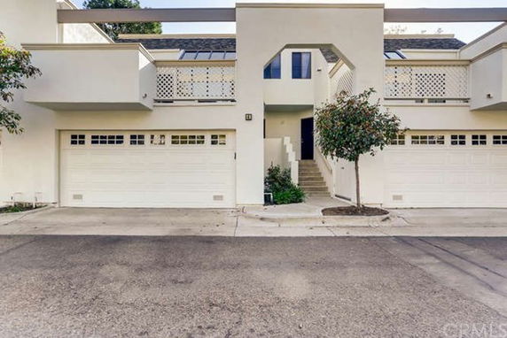 Front view of a two-story house with two garages.