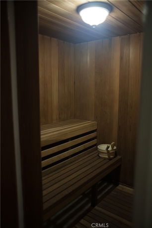 Interior view of a wooden sauna room with benches.