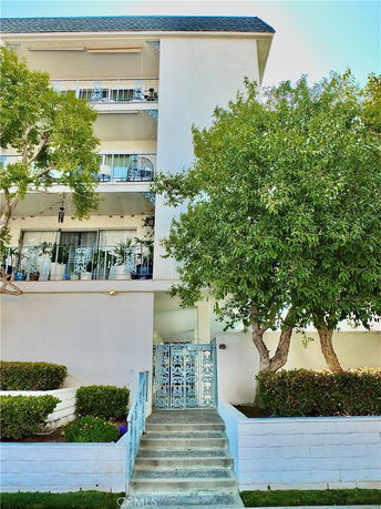 Front view of a multi-story building with balconies