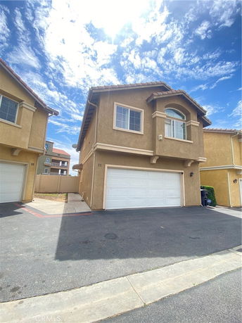 Front view of a two-story house with a double garage.