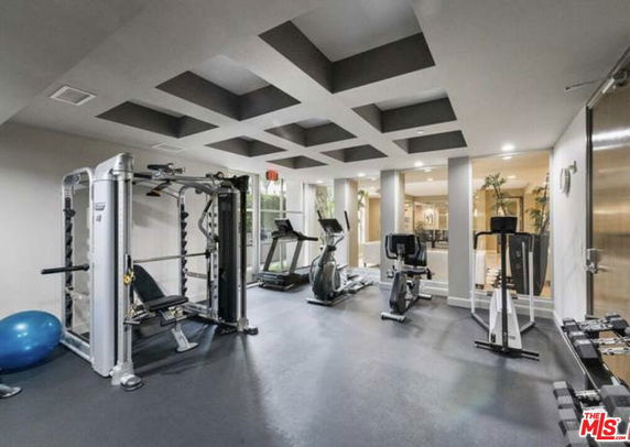 Indoor gym area with exercise equipment.