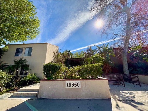 Front view of a two-story building with an entrance marked by the number 18350.
