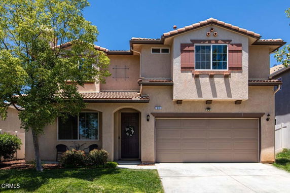 Front view of a two-story house with a double garage.