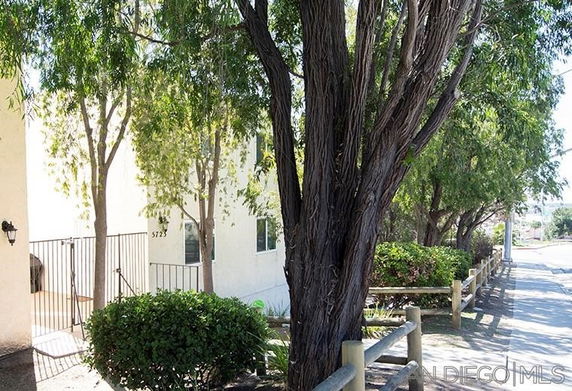 View of a building with trees and pathway.