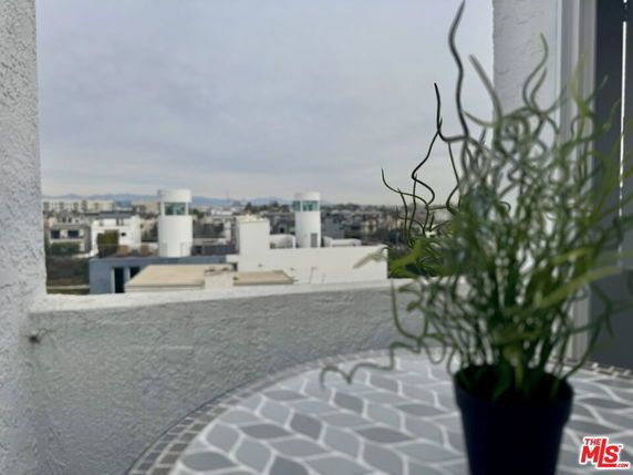 View from a building showing surrounding urban area with multiple buildings.
