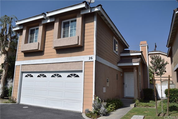 Front view of a two-story house with a double garage.