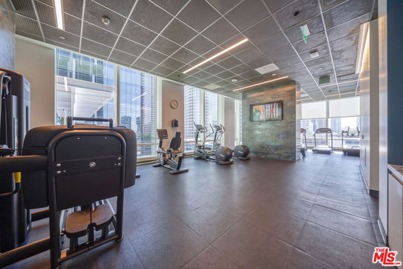 Indoor gym with exercise machines and equipment.