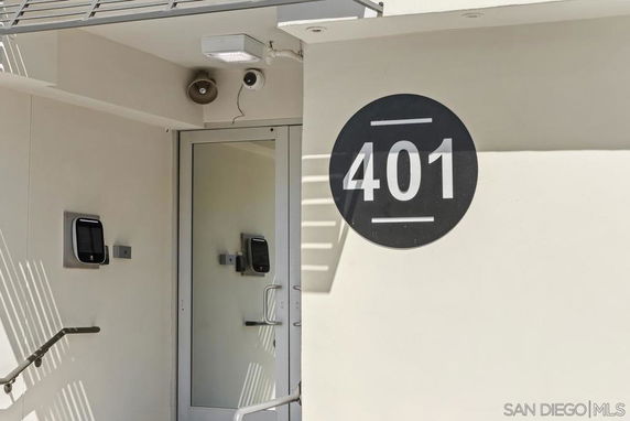 Front view of a building entrance with the number 401 on the wall.
