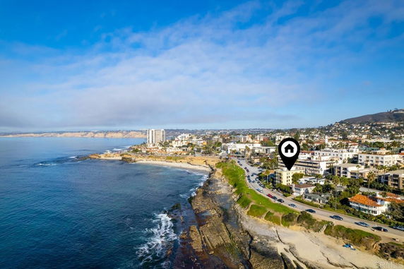 Panoramic view of coastal area with buildings and ocean.