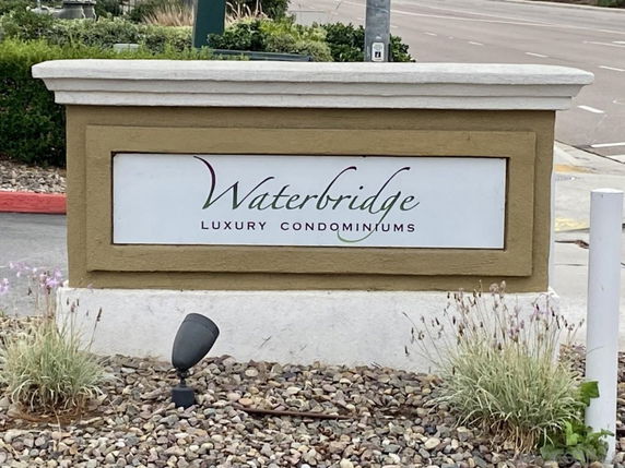 Entrance sign for Waterbridge Luxury Condominiums.