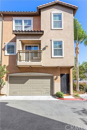 Front view of a multi-story house with a double garage.