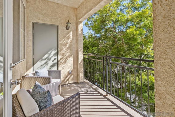 Balcony with seating overlooking trees