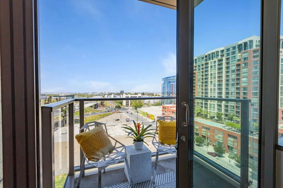 Panoramic view of surrounding buildings from a balcony.