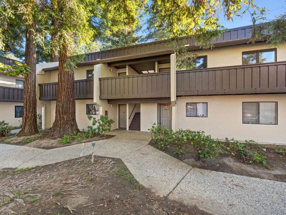 Front view of a two-story residential building with balconies.