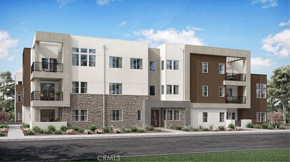 Front view of a modern multi-story apartment building with balconies.